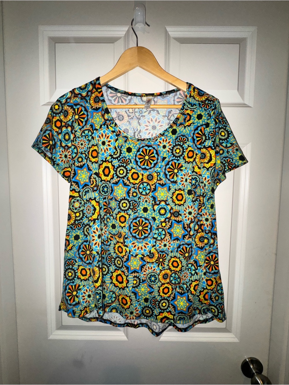 LuLaRoe Short Sleeve V-Neck Top in Turquoise, Yellow & Black Geometric Print